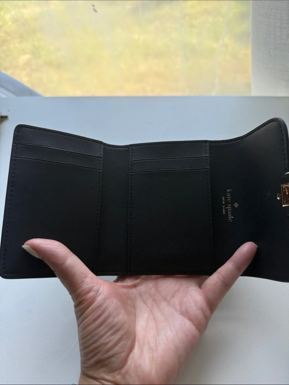 kate spade Black Leather Compact Wallet with Gold-Tone Pyramid Accent